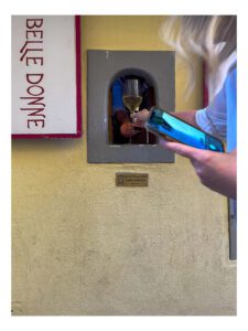 Getting my glass of wine from a Buchette Del Vino