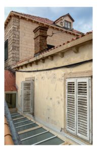 Bullet holes from the Yugoslav wars still pockmark some buildings